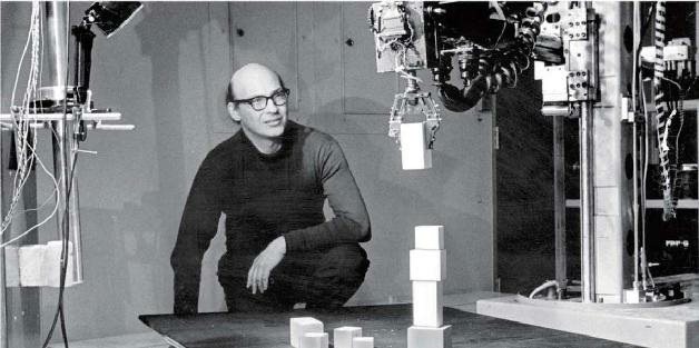 马文·明斯基在观察机器人堆积木（照片拍摄于1968年左右）